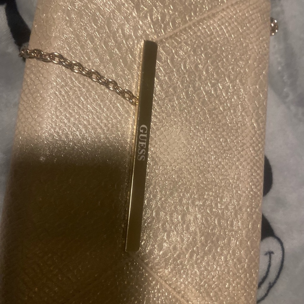 Elegant Gold Clutch with Wristlet and Sleek Design